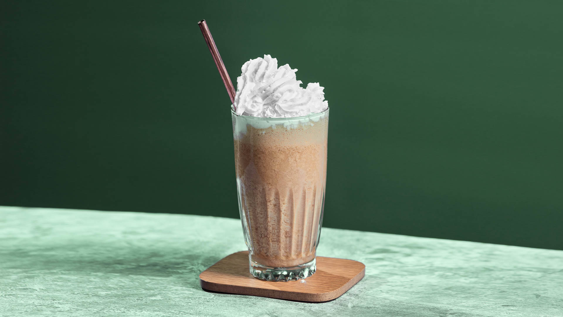 Glass of Mint Mocha in a green setting