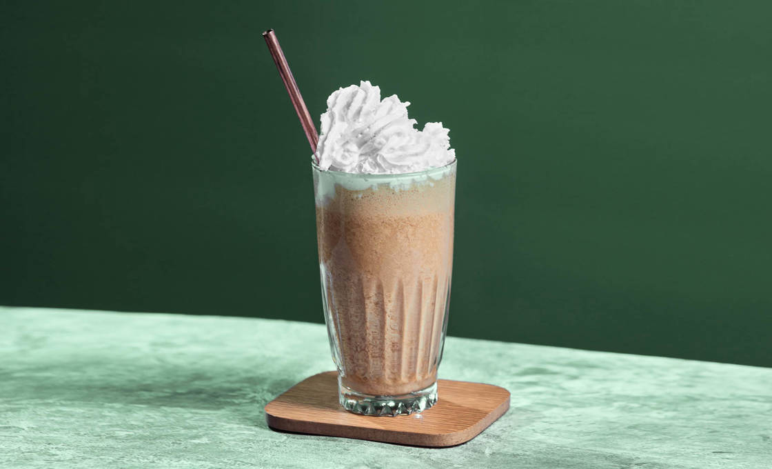 Glass of Mint Mocha in a green setting