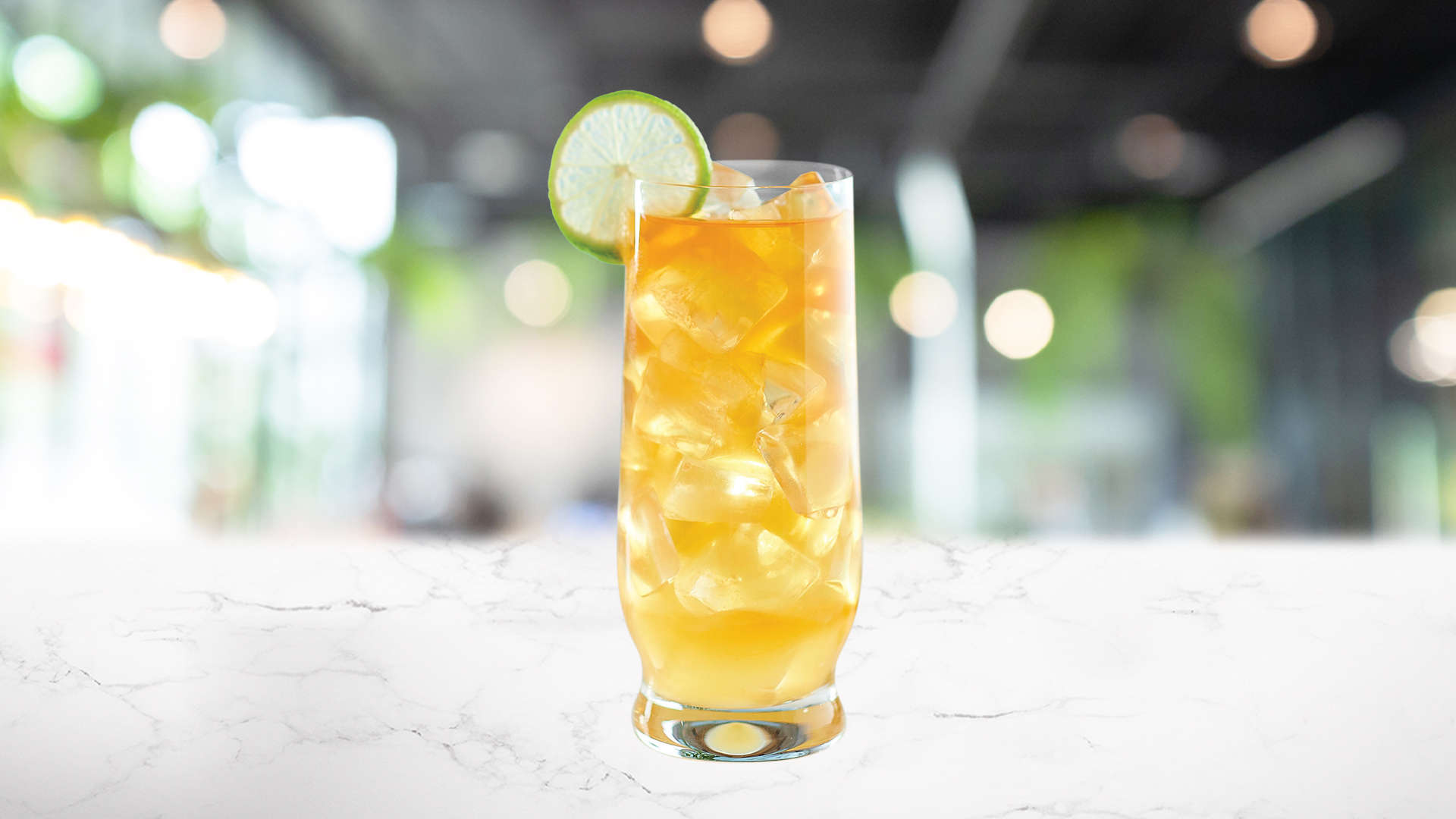 glass of Rum Punch on a marble surface