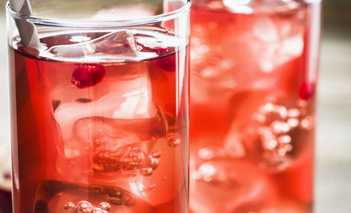 two glasses of Grenadine Booster side by side