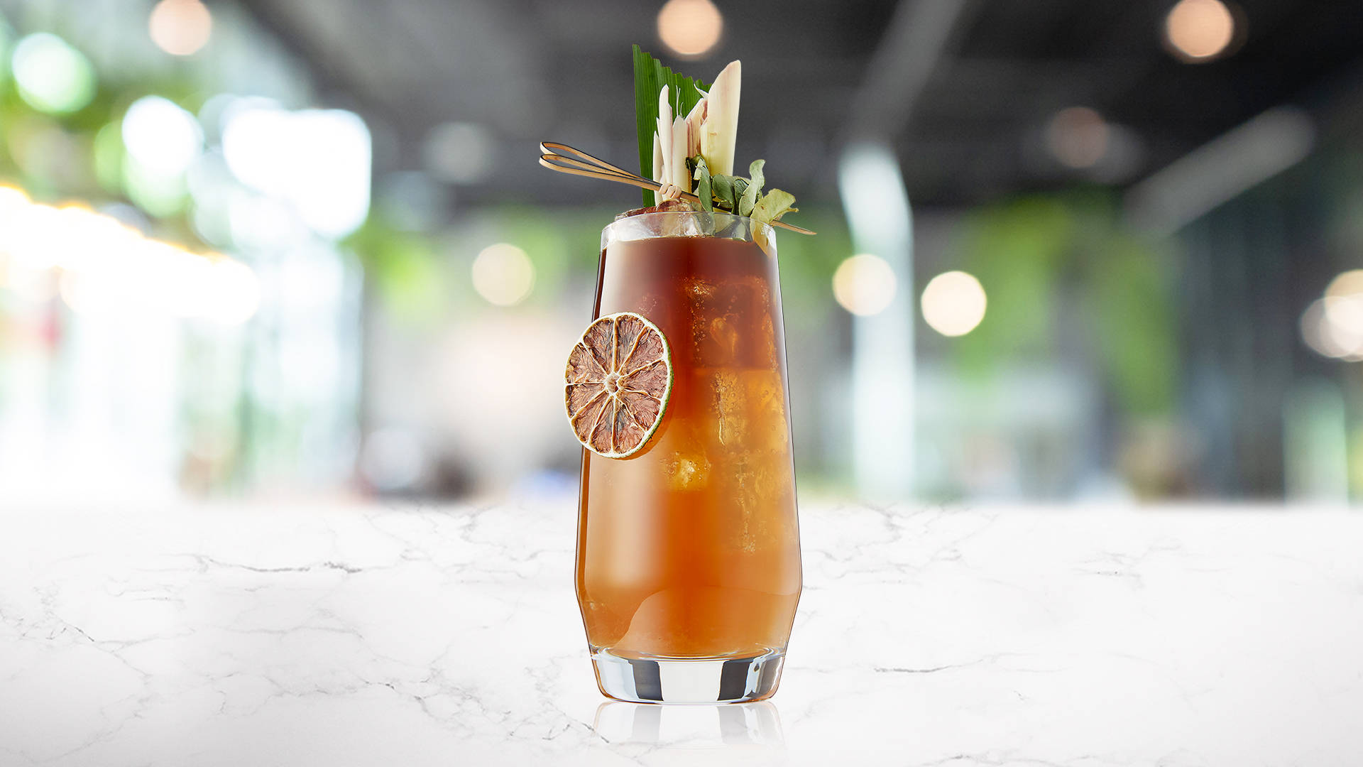 Garnished glass of Pomegranate Tea'ade