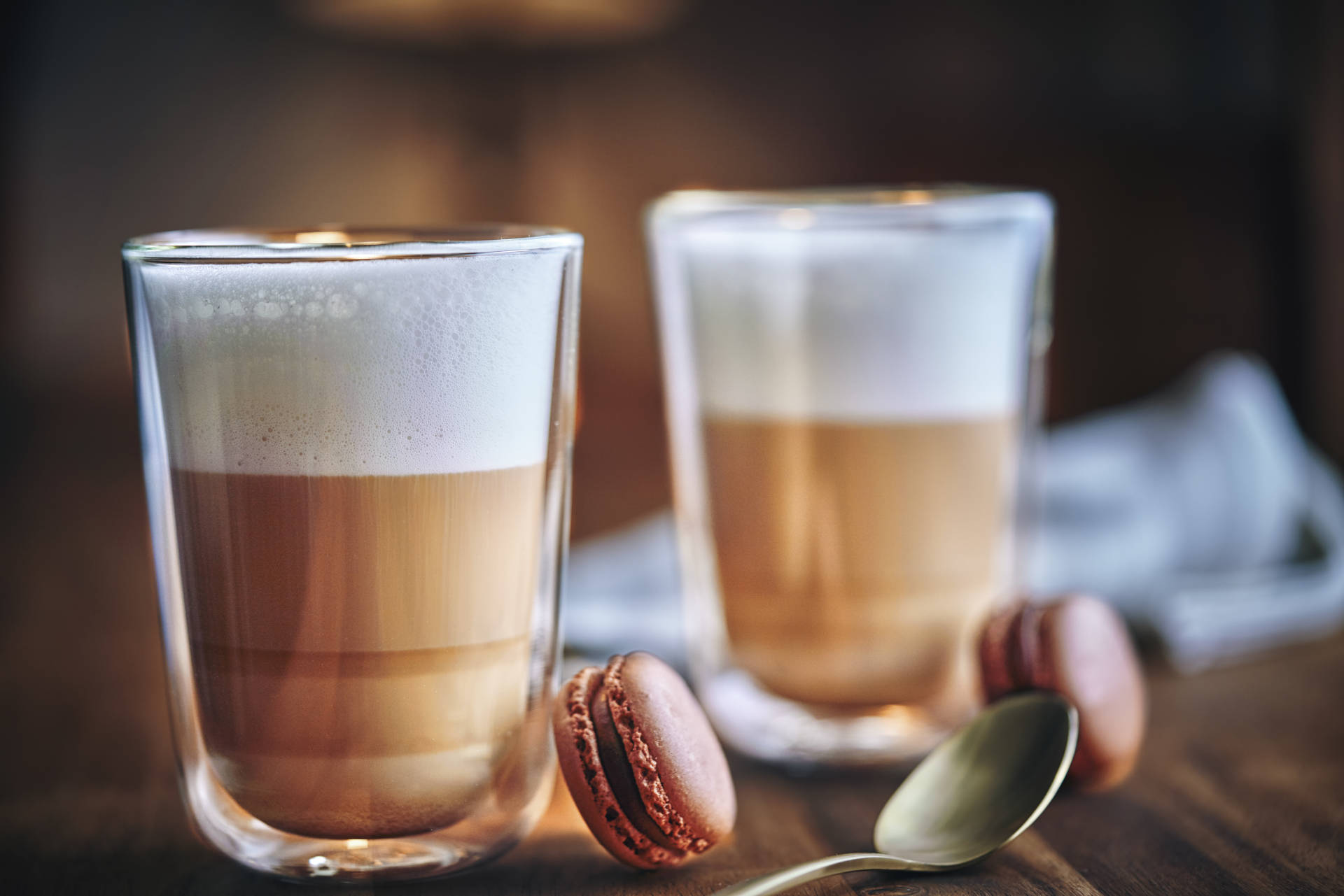 Two glasses of Fruit macchiato with macarons