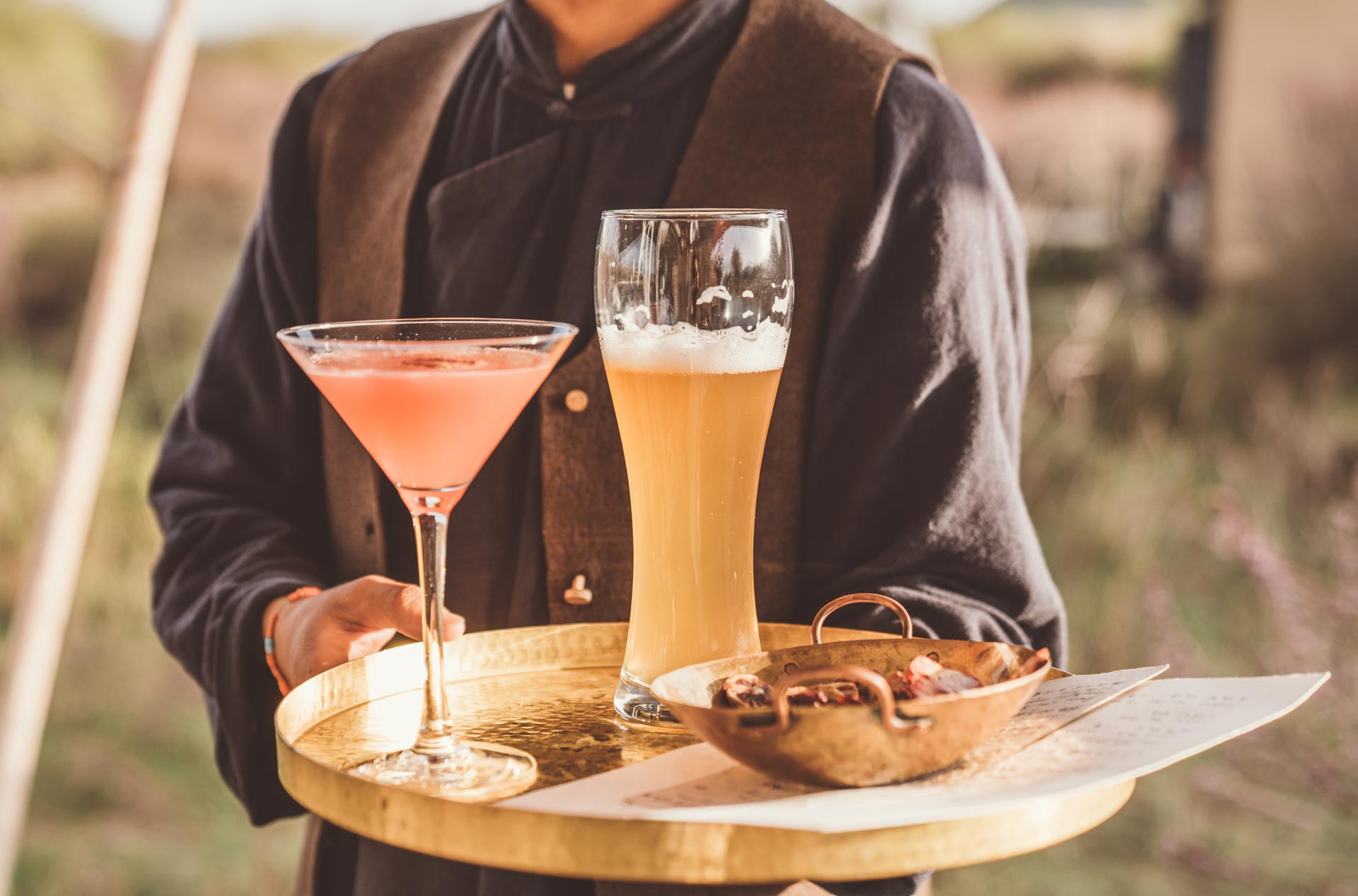 tray with martini, beer and snack