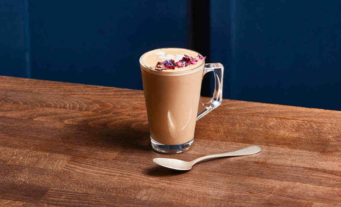 Glass of Rose Latte with spoon