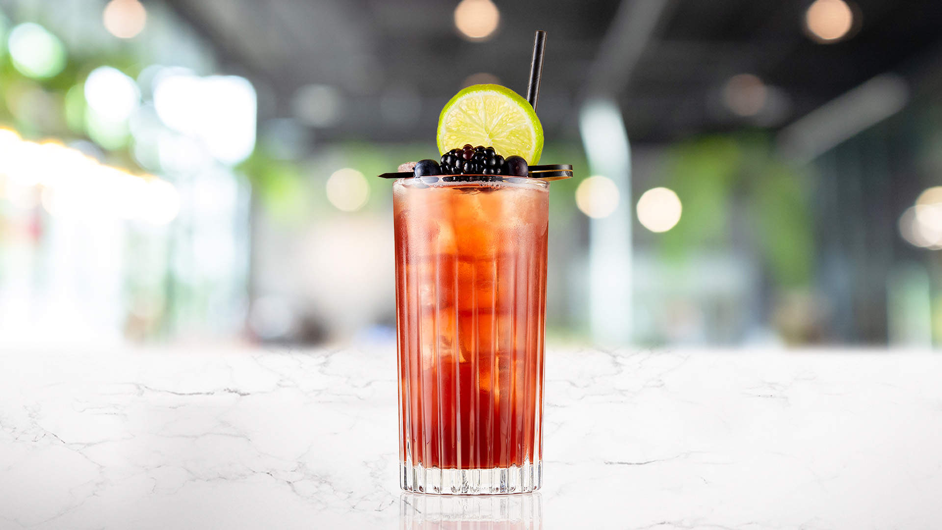 Glass of Blackcurrent & Black Tea on a marble surface