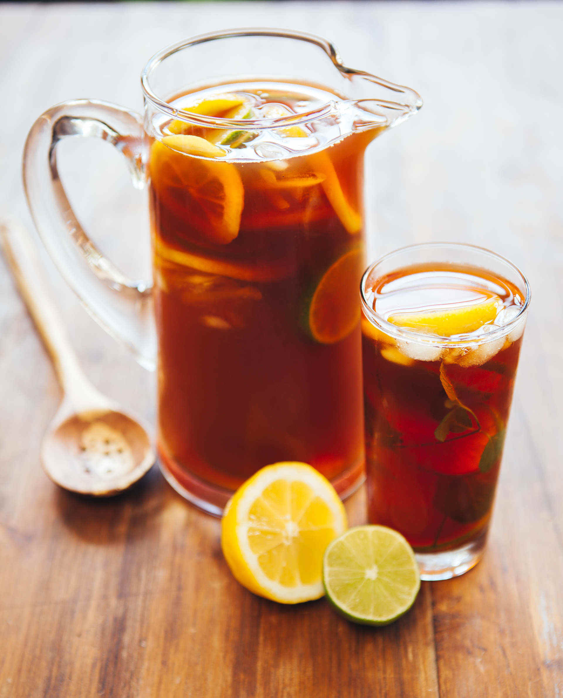Jug and glass of Minty Mint Tea with lemon and lime