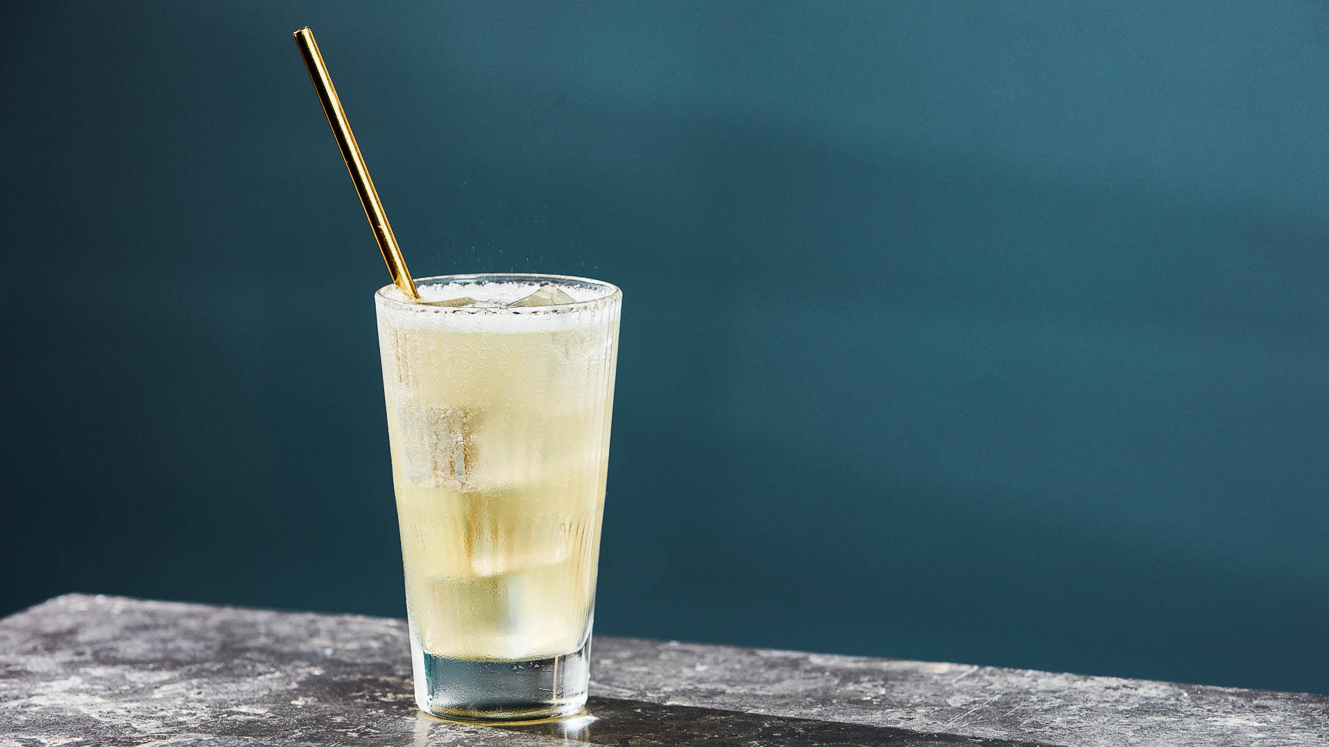 Glass of Friut Fizz on a graphite surface