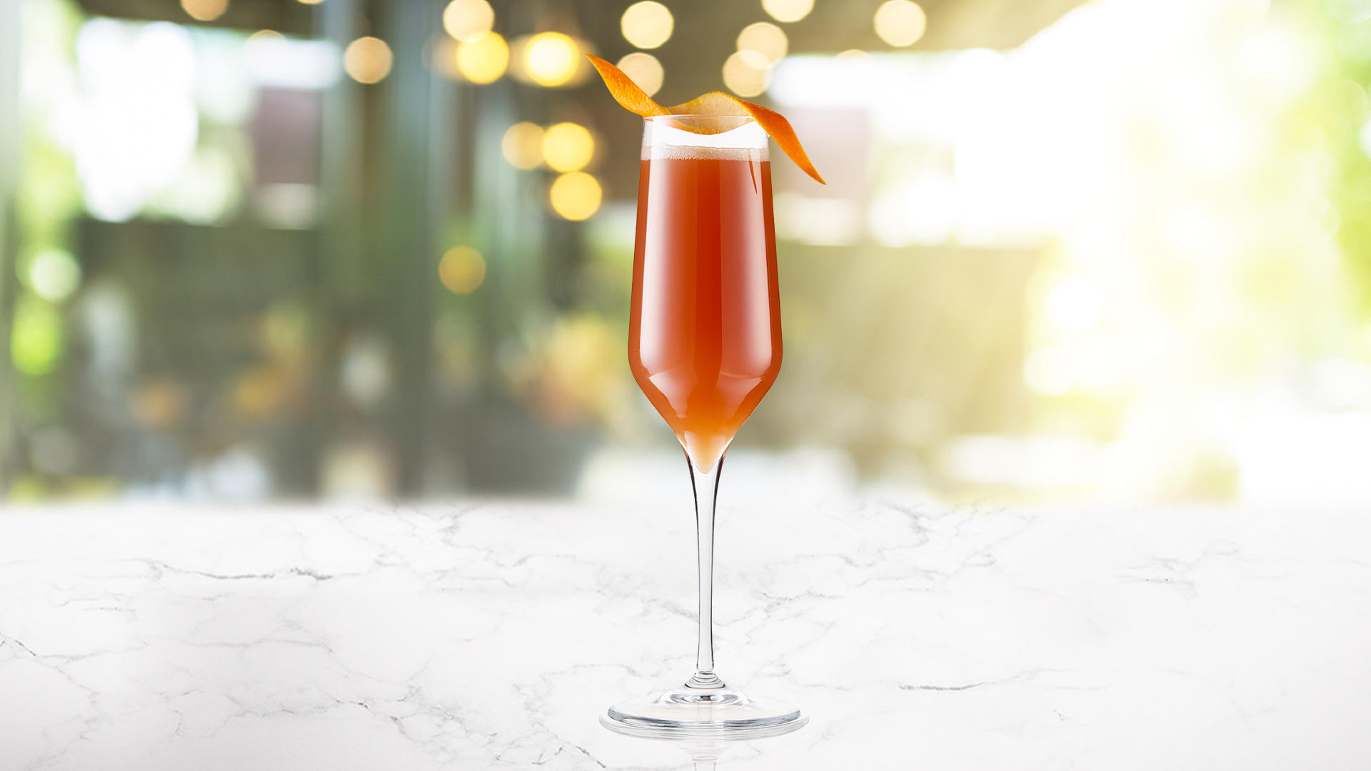 A glass of Pomegranite Mango Bellini