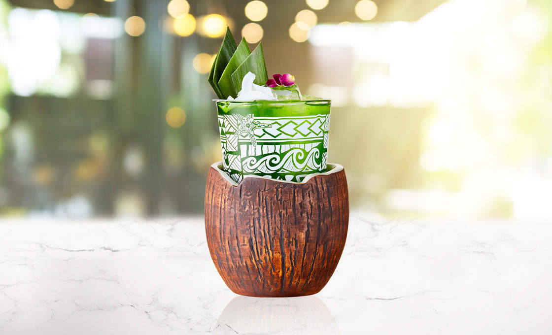 Glass of pandan cooler in a coconut