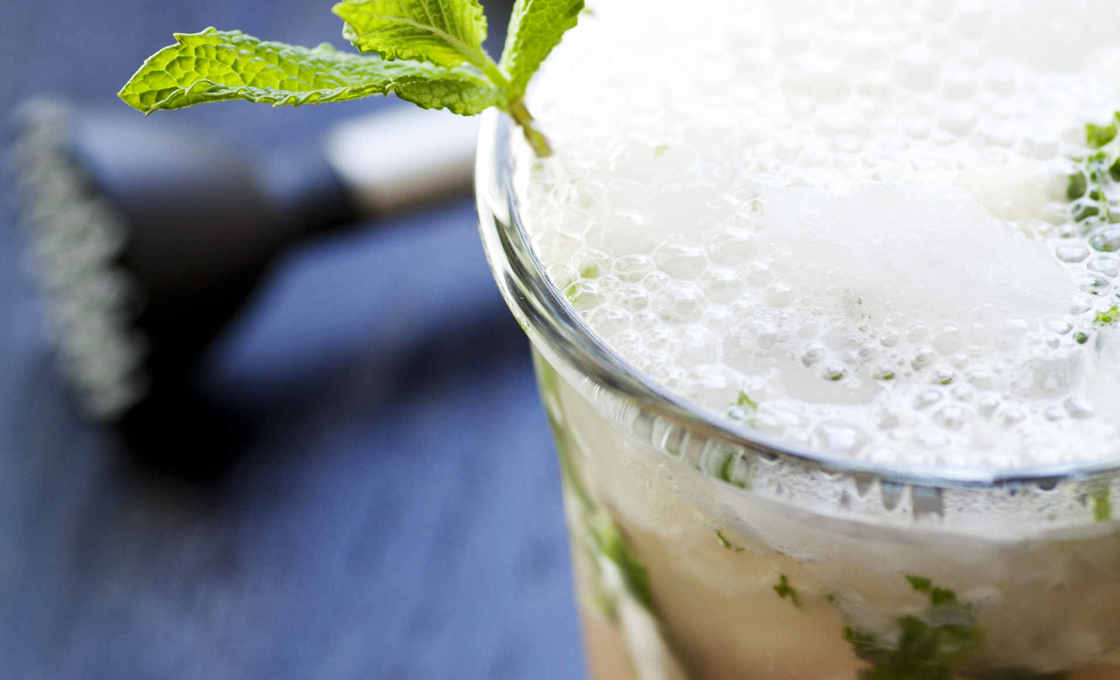 A glass of Saudade on a table