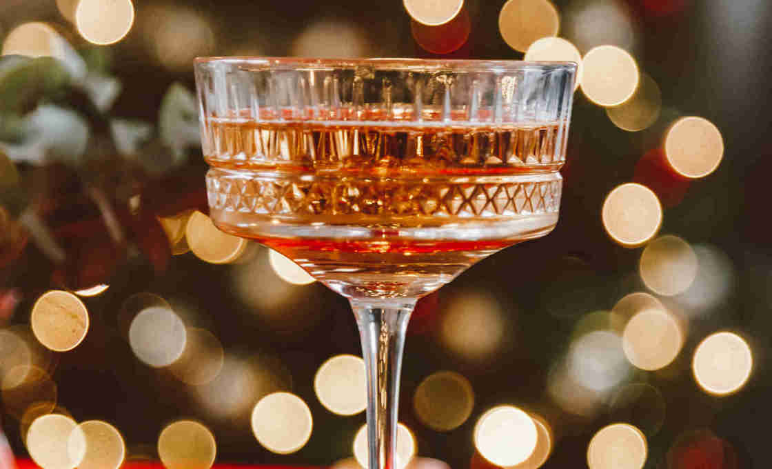Cinnamon Kir on a table with several coloured mats