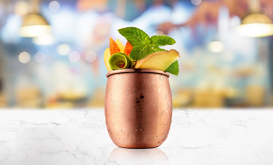 Green Tea & Apple Mule in a copper mug