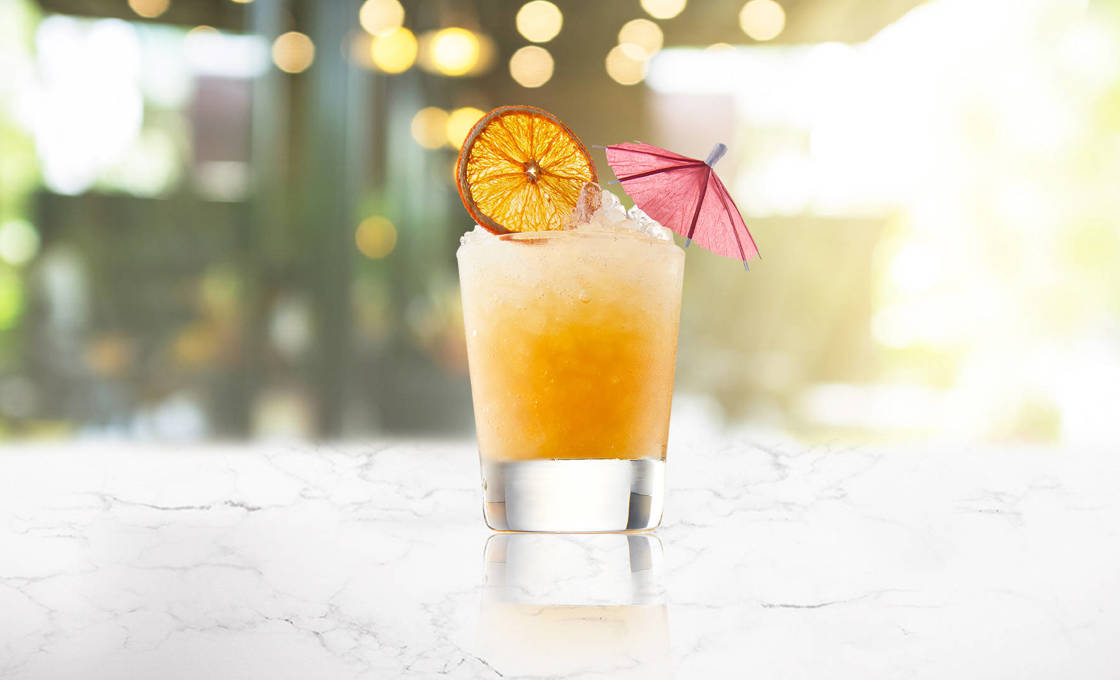 A glass of sunny day cocktail on a transparent background